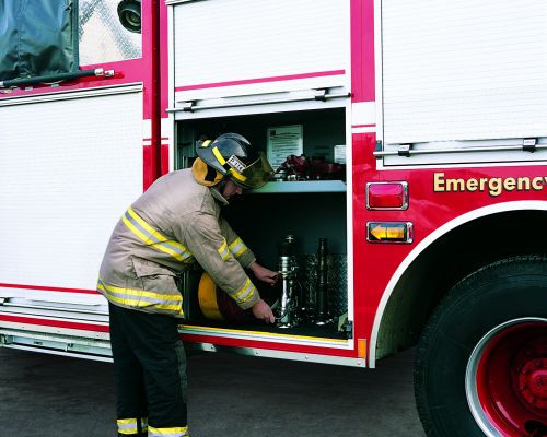 Fireman with roll-up doors on firetruck